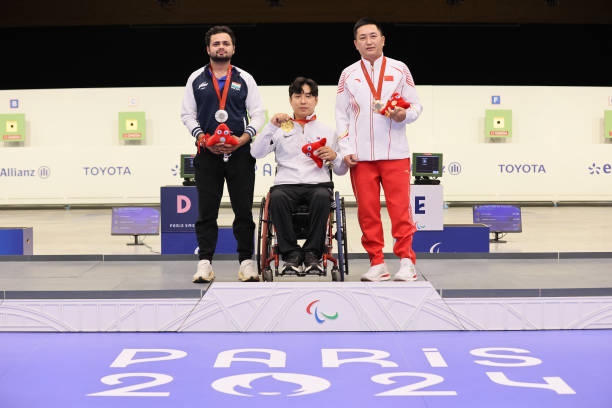 Silver medallist Manish Narwal of Team India (L), gold medallist Jeongdu Jo of Team Republic of Korea (C) and bronze medallist Chao Yang of Team People's Republic of China (R) pose on the podium during the medal ceremony